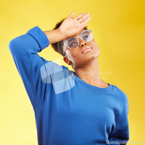 Image of Thinking, tired and black woman with headache in studio isolated on a yellow background. Stress, problem and sick African person with financial crisis, fatigue and brain fog, vertigo and frustrated
