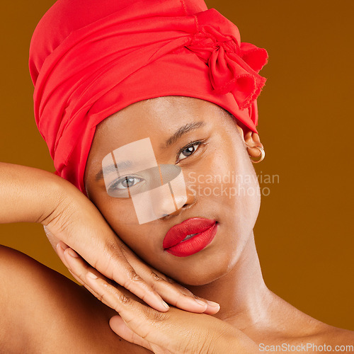 Image of Beauty, woman and stylish wrap with face and red lips portrait and scarf for care and wellness in studio. Brown background, female person and cosmetics with African model and makeup for facial glow