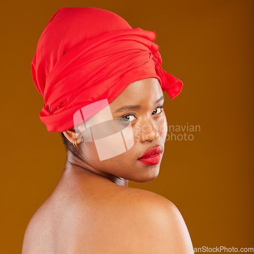 Image of Woman, portrait and hair scarf with red lipstick for beauty, makeup and haircare in studio. Brown background, African female person and cosmetics of a model with head wrap for culture with glow