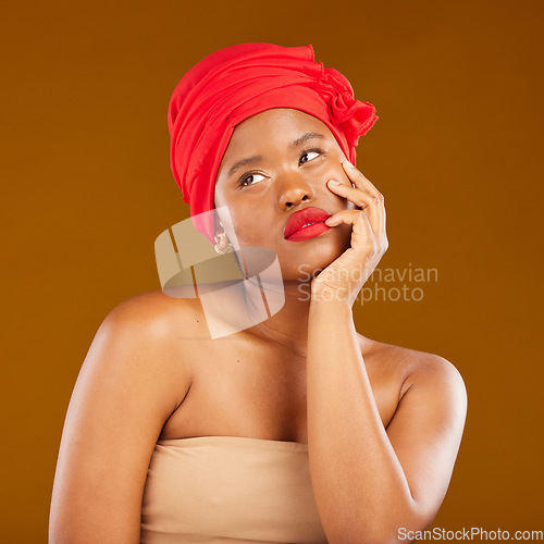 Image of Beauty, makeup and thinking with face of black woman in studio for cosmetics, creative and pride. Skincare, salon and red lipstick with model on brown background for wellness, self care and glow