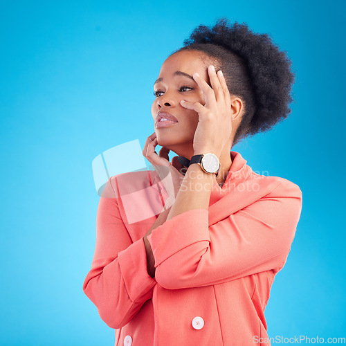 Image of Faint, thinking and black woman with sad face, fashion and stylish outfit on a blue studio background. Female person and model feeling tired from emotion or drama in elegant clothes and trendy style