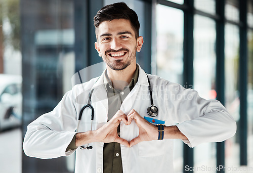 Image of Happy portrait man, doctor and heart hands for healthcare love, medical service trust and hospital support. Cardiology, emoji health icon and male surgeon for wellness, clinic help or life insurance