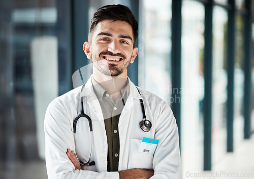 Image of Portrait, arms crossed and confident doctor, happy man or surgeon smile for healthcare, medical service and hospital support. Cardiology expert, professional and cardiologist pride in wellness clinic