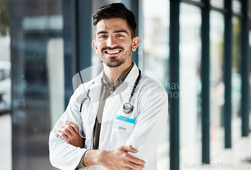 Image of Portrait, doctor arms crossed and man smile for medical services, GP clinic support or professional medicare help. Medicine healthcare expert, hospital trust and surgeon pride in health wellness