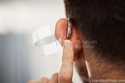 Image of Closeup of ear, hearing aid and man with disability from the back for support, improve listening or amplifier with mockup space. Deaf patient, face and audiology implant to help volume of sound waves