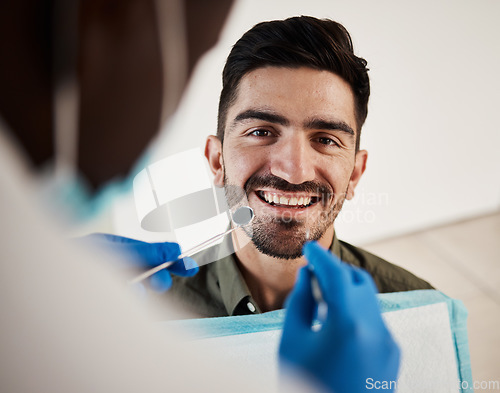 Image of Portrait, man and hands of dentist with tools for dental, healthcare or check in clinic. Face smile, orthodontics and patient with doctor, mirror and excavator for teeth cleaning and medical hygiene