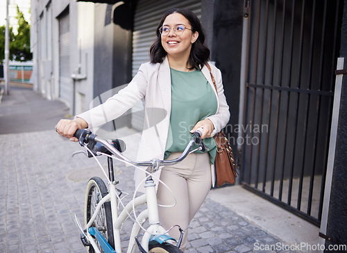 Image of Business, woman and walking with bicycle in outdoor with smile for travel to work with marketer. Happy, business and female person with transportation for cycling to commute in city with bag for job.