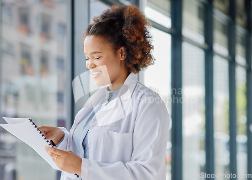 Image of Woman, doctor and reading healthcare documents for hospital administration, research paper and review. Happy black female medical worker planning checklist of insurance report, test results or script