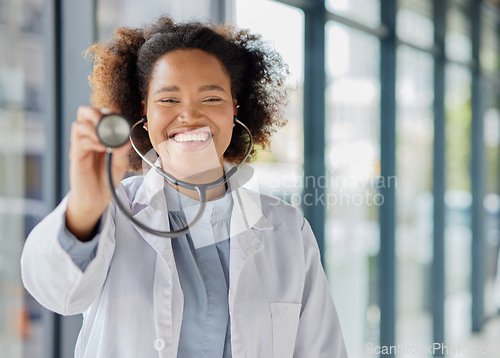 Image of Doctor, portrait and woman listening with stethoscope for heartbeat, healthcare and cardiology. Happy black female medical worker with tools to check heart, lungs or breathing test for help in clinic