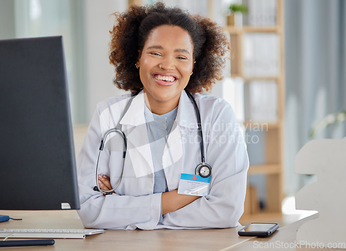 Image of Black woman, portrait and doctor at desk in hospital for medical services, advice and consultation. Medicine, healthcare and happy young female therapist confident in consulting with trust in clinic