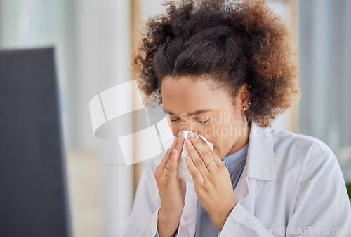 Image of Woman, sick doctor and blowing nose in hospital with allergy, influenza or virus. Black female healthcare professional, tissue and allergies in clinic for problem, cold and bacteria in medical office