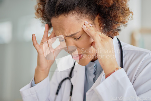 Image of Headache, tired doctor and black woman in hospital with burnout, clinic problem and challenge of stress. Face of frustrated female healthcare worker with fatigue, migraine pain and anxiety of mistake