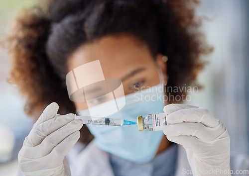 Image of Hands, medical and a doctor or black woman with a vaccine for healthcare, virus safety or prescription. Closeup, medicine and an African nurse or hospital employee with a vial or syringe for smallpox