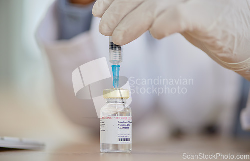 Image of Smallpox vaccine, vial and hands of doctor for safety, healthcare or medicine in hospital. Closeup, nurse and prepare vaccination, virus injection and bottle for immunity, medical development or help