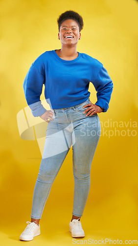 Image of Happy, fashion and portrait of a black woman on a studio background for style and trendy aesthetic. Smile, beautiful and a young African girl or model in clothes isolated on a yellow backdrop