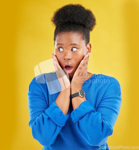 Image of African girl, surprise and face with news or announcement in isolated or yellow studio background for notification. Wow, gossip and woman with open mouth or omg expression about drama or secret.