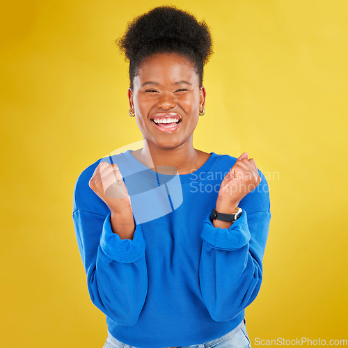 Image of Excited, celebration and portrait of black woman in studio happy with news, deal and announcement on yellow background. Smile, face and African female winner celebrating lottery, bonus or promotion