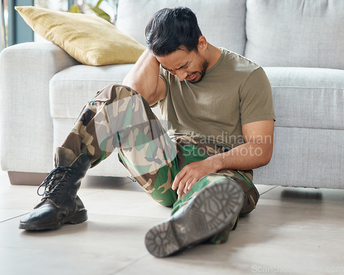 Image of Military, army and a man crying for trauma and depression on a floor with mental health problem. Soldier, psychology and a sad male veteran person with anxiety, fear and frustration or ptsd crisis