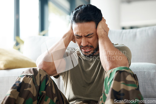 Image of Soldier, man and stress, headache or PTSD of military trauma, remember pain and fear or scared on floor. Sad, frustrated and mental health of army or veteran person with depression or anxiety at home