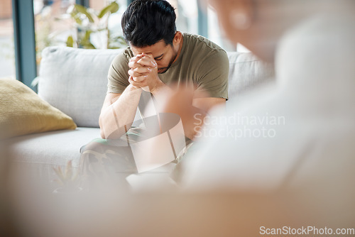 Image of Sad, ptsd and male soldier in therapy for mental health, depression or grief after a military war. Frustrated, trauma and man army warrior talking to a psychologist about emotions in a clinic office.