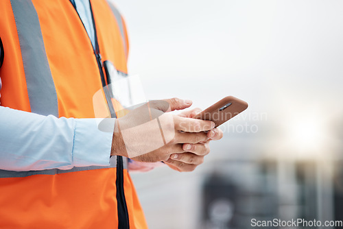 Image of Phone, architecture and hands of man in city for engineering, construction site and communication. Building, social media and mobile app with closeup of contractor for contact, networking and mockup