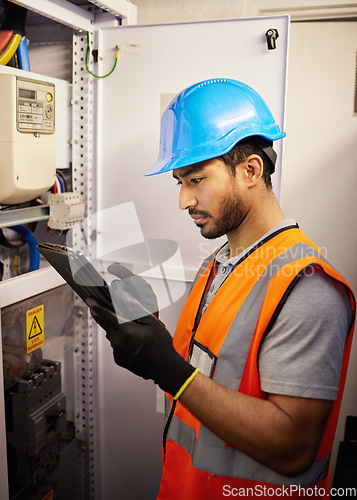 Image of Tablet, engineering and man with electricity box for repair, maintenance and technician inspection. Industrial, electrician and male worker on digital tech for service, test or power source check