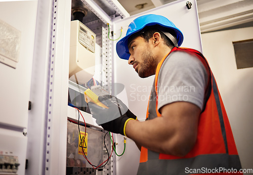 Image of Electrician, engineering and inspection with man in control room for multimeter, mechanic and safety. Electricity, energy and power with technician and check for generator, maintenance and circuit