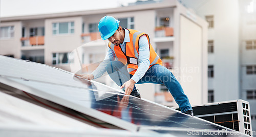Image of Technician man, construction and solar panel on roof for maintenance, sustainability or inspection in city. Engineer, check and photovoltaic system for building, industry and renewable energy in cbd