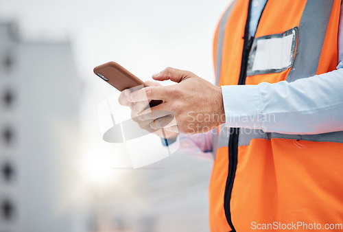 Image of Phone, engineering and hands of man in city for architecture, construction site and communication. Building, social media and mobile app with closeup of contractor for contact, networking and mockup