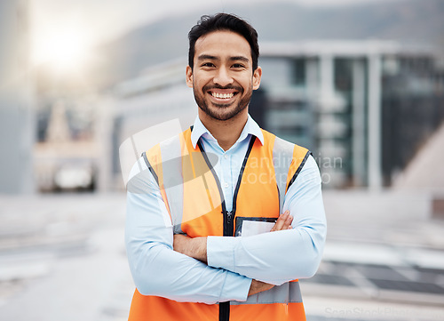 Image of Portrait, construction worker and man smile with arms crossed with solar panel job outdoor. Roof, eco engineer and green energy project with builder and sustainability contractor ready for work