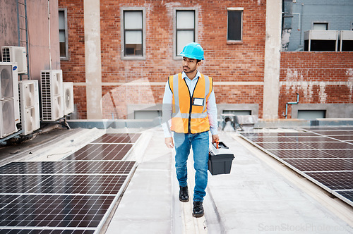 Image of Solar panel, tool box and inspection with man on roof top for renewable energy, project or power. Construction, electricity or technician with contractor in city for engineering and photovoltaic grid