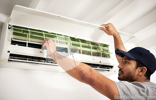 Image of Maintenance, air conditioner technician and man with filter, working on ventilation or ac repair. Contractor, handyman or electric aircon machine expert problem solving or cleaning dust in office