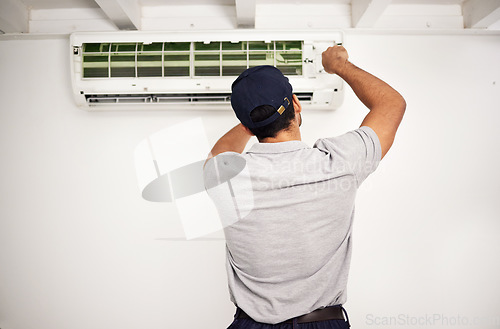 Image of Maintenance, air conditioning technician and man from back working on ventilation filter for ac repair. Contractor, handyman or electric aircon machine expert problem solving, electrician with tools.