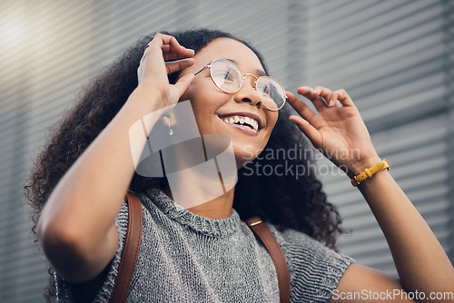 Image of .Woman, smile and city travel of student with glasses on a street with vision of future dream. Urban, university holiday and happy young African person walking with backpack on adventure or vacation.