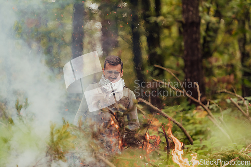 Image of Angry terrorist militant guerrilla soldier warrior in forest