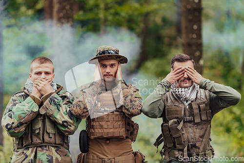 Image of Group of soldiers in oposit sides celebrating peace after battle by showing blind mute and deaf symbols
