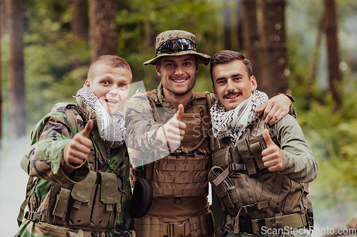 Image of Group of soldiers in oposit sides celebrating peace after battle