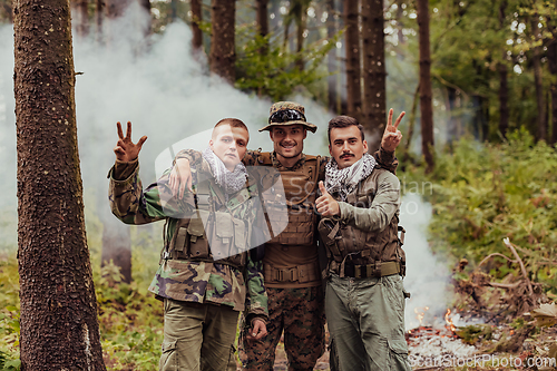 Image of Group of soldiers in oposit sides celebrating peace after battle