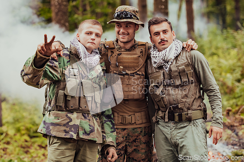 Image of Group of soldiers in oposit sides celebrating peace after battle