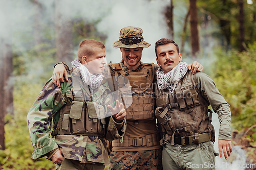 Image of Group of soldiers in oposit sides celebrating peace after battle