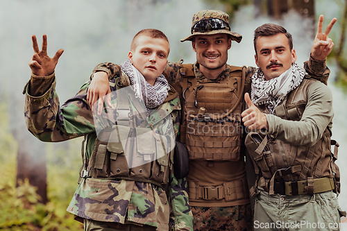 Image of Group of soldiers in oposit sides celebrating peace after battle