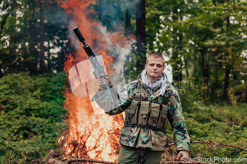 Image of Angry terrorist militant guerrilla soldier warrior in forest