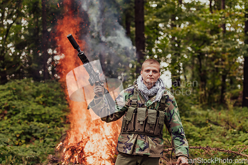 Image of Angry terrorist militant guerrilla soldier warrior in forest