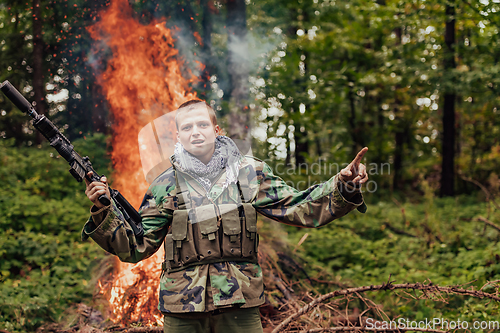 Image of Angry terrorist militant guerrilla soldier warrior in forest