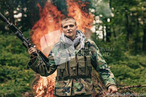 Image of Angry terrorist militant guerrilla soldier warrior in forest