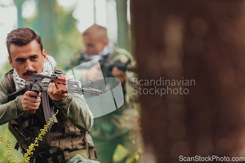 Image of Angry terrorist militant guerrilla soldier warrior in forest