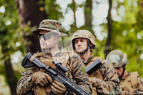 Image of Modern warfare Soldiers Squad Running as Team in Battle Formation