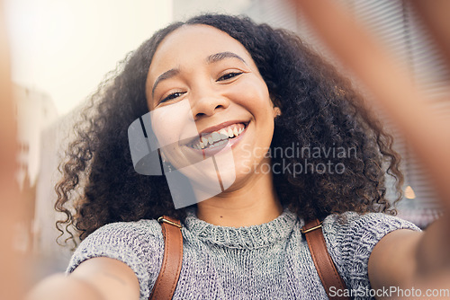 Image of Happy, selfie and portrait of a woman in the city for exploring or sightseeing on weekend trip. Social media, smile and face of African young female person from Mexico taking a picture in urban town.