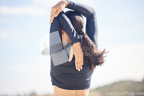 Image of Woman, fitness and back stretching for exercise, workout or outdoor running in nature. Rear view of female person, athlete or runner in body warm up, preparation or getting ready for cardio training