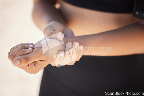 Image of Fitness, closeup and woman with a wrist injury, accident or sprain muscle after a workout. Sports, medical emergency and zoom of a female athlete with hand joint pain after a exercise or training.